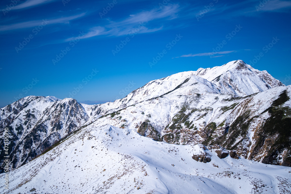 富山県立山町にある立山の冬の雪景色のある風景 Landscape with snowy winter scenery of Tateyama in Tateyama Town, Toyama Prefecture, Japan.