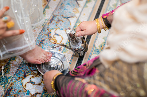 Muslim wedding ceremony washing feet close up