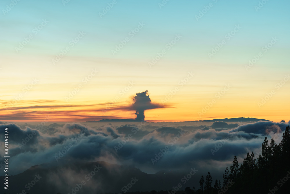Volcanic cloud in the background