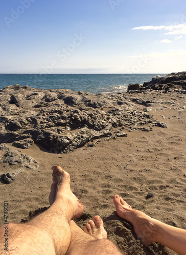 Feet in the sand on the beach