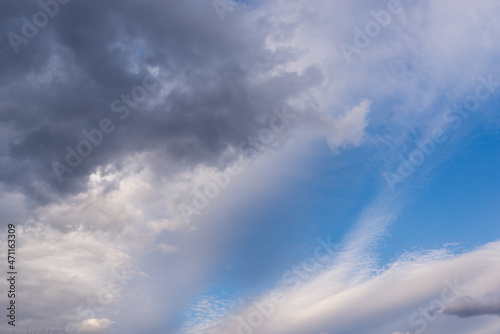 Blue sky with clouds in the early morning. © Ilya