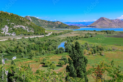 Skadar lake and the valley of the city of Virpazar. Montenegro  Balkans. Beautiful landscape with mountains and a river.