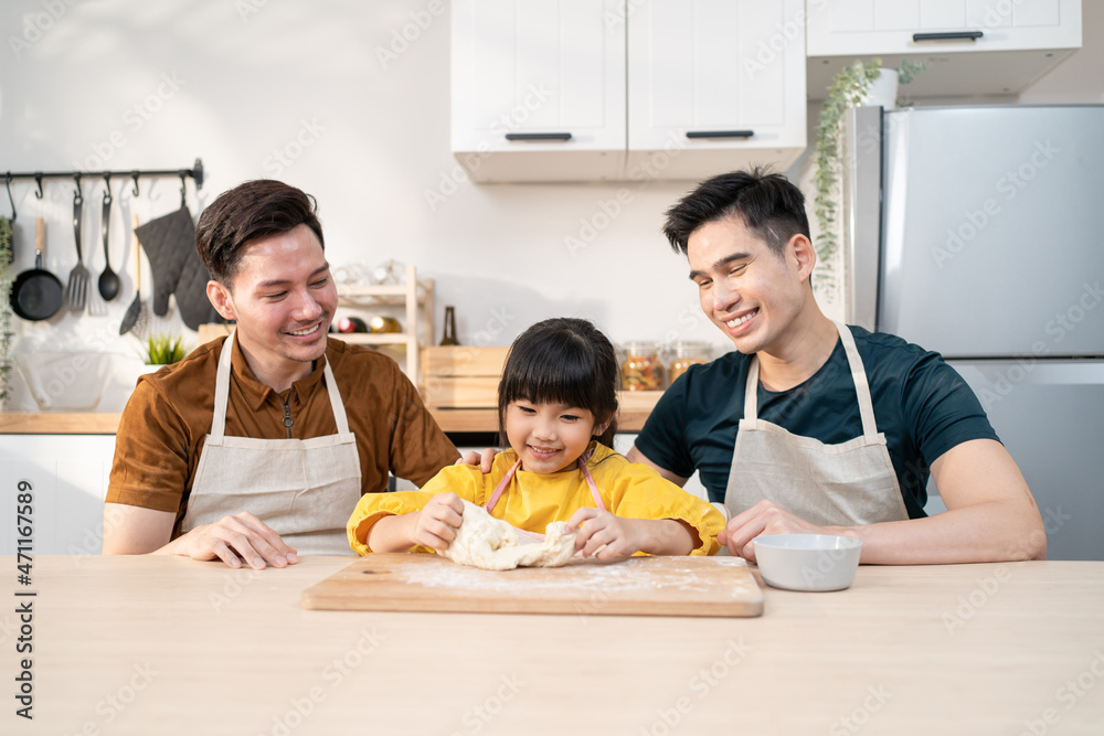 Asian attractive LGBTQ gay family teach girl kid making yeast dough. 
