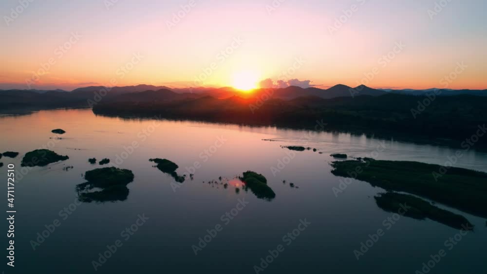 4K flying a drone over a river and wetland area, bright weather and amazing nature landscape
4K flying a drone over a river and wetland area, bright weather and amazing nature landscape