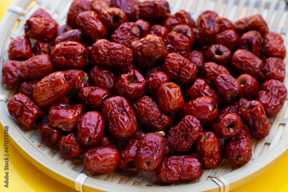 Chinese jujubes in round bamboo basket