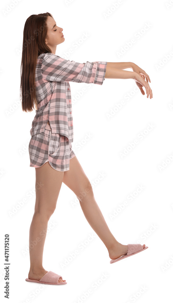Young woman wearing pajamas and slippers in sleepwalking state on white background Young woman wearing pajamas and slippers in sleepwalking state on white background