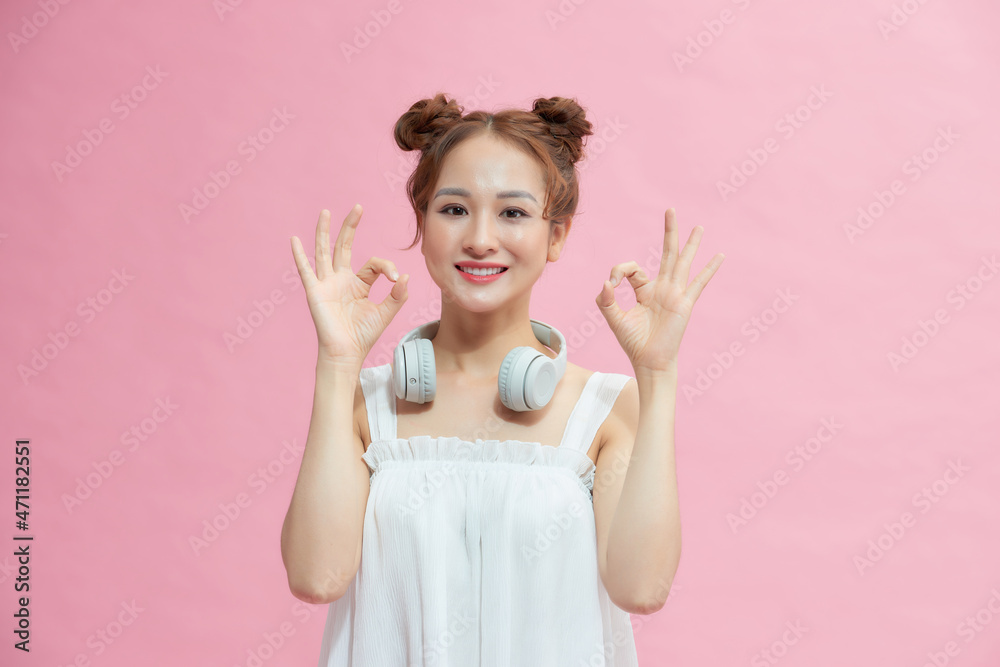 Attractive young adult woman showing ok sign Attractive young adult woman showing ok sign