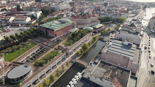 Water channel in Aveiro city center, Portugal. Aerial orbiting shot above downtown