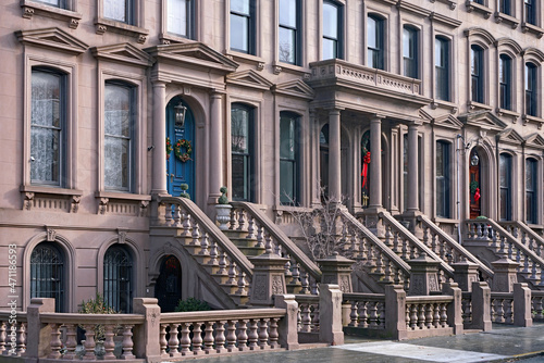 Konstfotografi Row of New York brownstone townhouses with Christmas decorations on doors