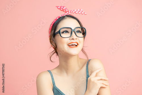 Portrait of beautiful asian girl laughing out loud on some joke or funny story.