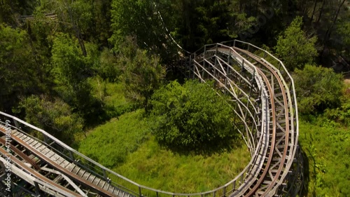 Aerial drone view of the neglected wooden rollercoaster at a decommissioned, semi abandoned amusement theme park that was known as Upper Clements Park in Upper Clements Nova Scotia photo