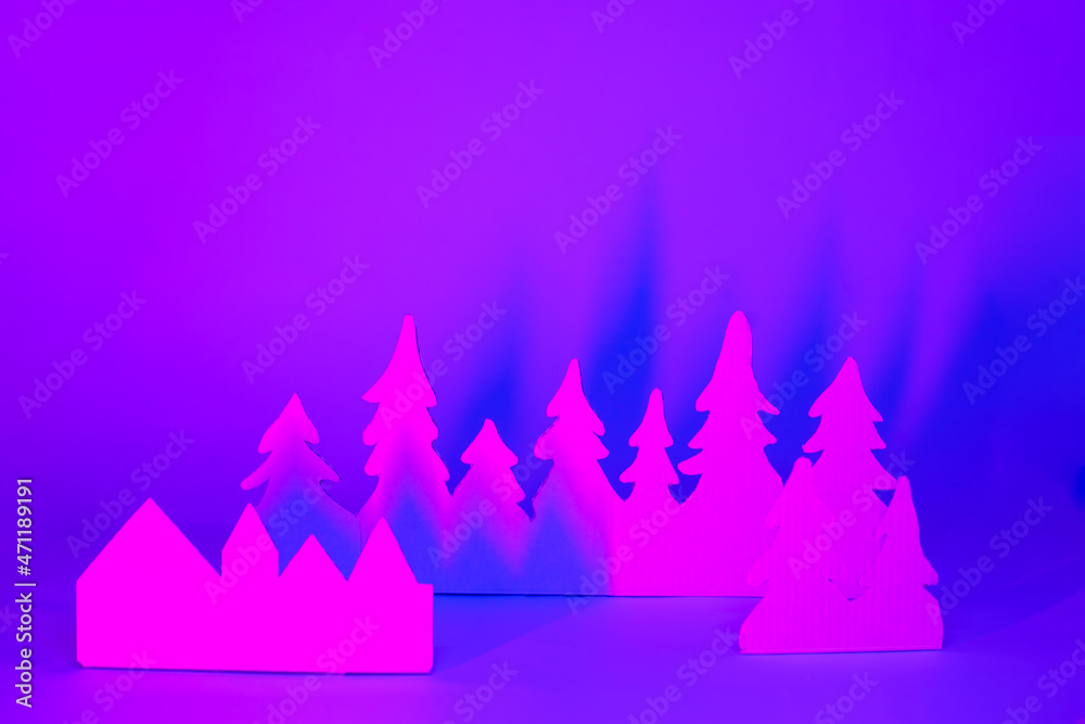 Futuristic modern abstract happy New Year 2022, Merry Chrstmas concept. Pine tree from paper on neon bright violet blue background, copy space, banner for your site, invitation, flyer