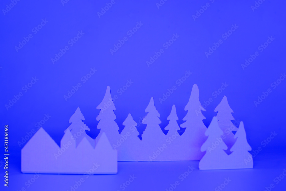 Obraz premium Futuristic modern abstract happy New Year 2022, Merry Chrstmas concept. Pine tree from paper on neon bright violet blue background, copy space, banner for your site, invitation, flyer