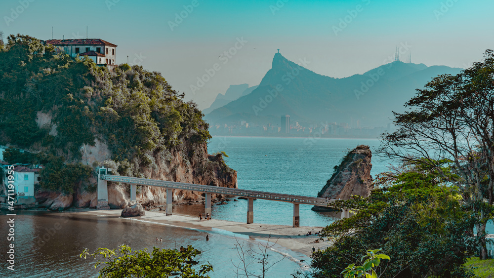 Rio de Janeiro, Brazil - CIRCA 2021: Coastal region of ocean beach during the day with sea, sand and rocks