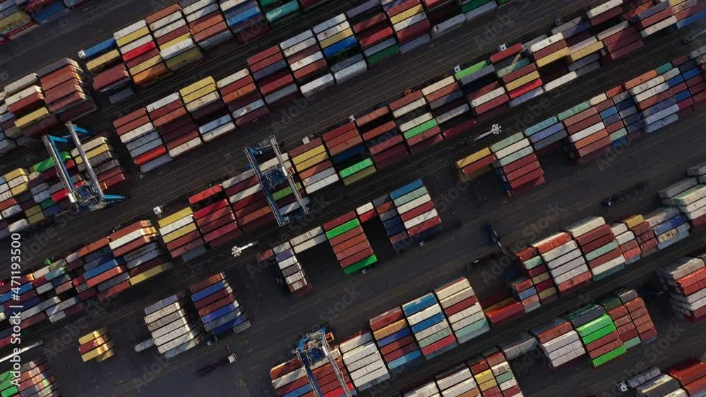 Container Port - Stacked Of Industrial Intermodal Containers With Gantry Cranes. - aerial