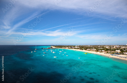 Wispy clouds over the turquoise waters and white sandy beaches