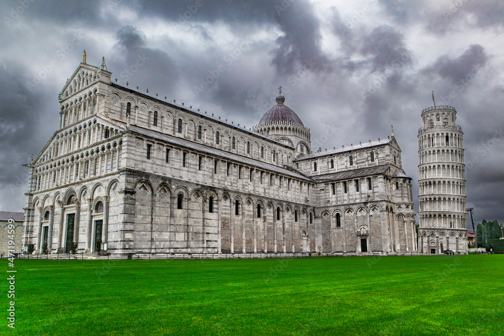 White stone Cathedral and leaning tower in Italy