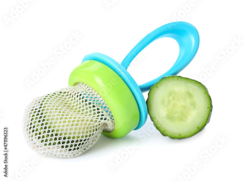 Nibbler with fresh cucumber on white background. Baby feeder photo