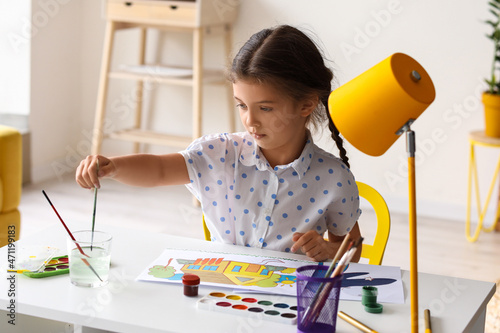 Cute little girl dipping br...