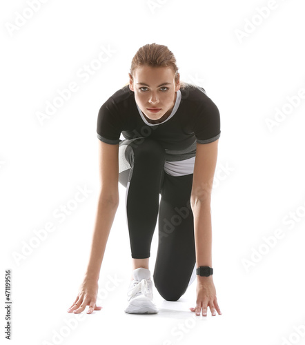 Sporty young woman in crouc...