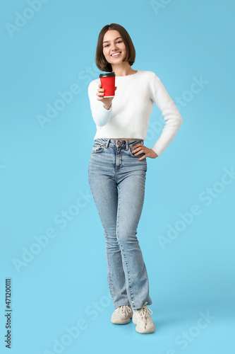 Beautiful woman with cup of...