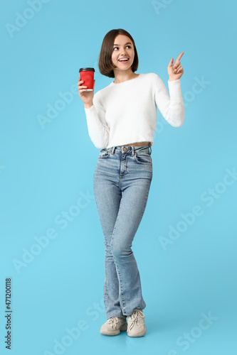 Beautiful woman with cup of...