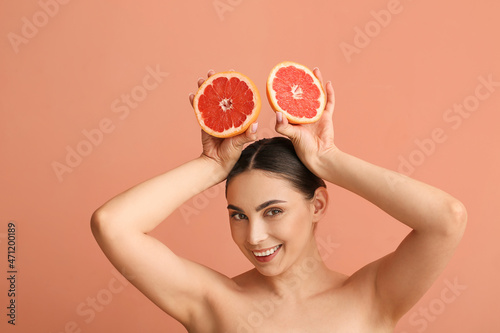 Smiling woman holding halve...