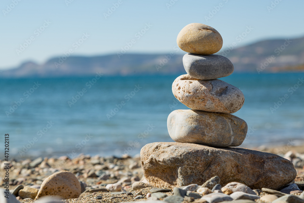 Pyramid stones balance on the sand of the beach. The object is in focus, the background is blurred.
Yesilovacik,Mersin,Turkey. Pyramid stones balance on the sand of the beach. The object is in focus, the background is blurred.
Yesilovacik,Mersin,Turkey.