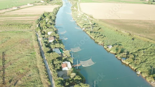 Aerial view of fishing huts in the river, Lido di Dante, Fiumi Uniti, Ravenna near Comacchio valley. photo