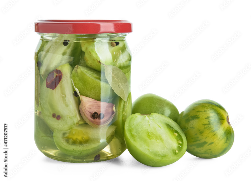 Jar with canned green tomatoes on white background Jar with canned green tomatoes on white background