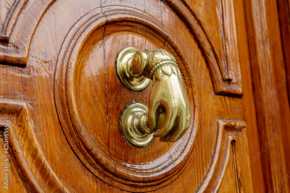 Madrid. Spain. The door handle.
Hand-shaped door handle. This is an antique hammer handle. Madrid. Spain. The door handle.
Hand-shaped door handle. This is an antique hammer handle.