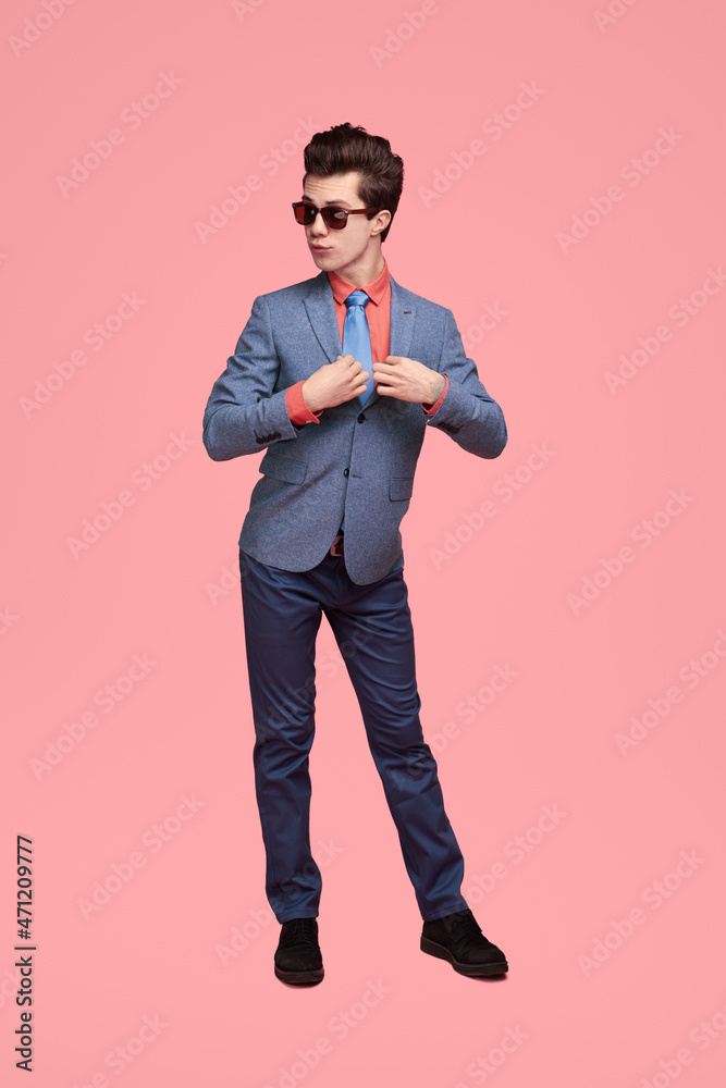 Funny stylish businessman standing in studio Funny stylish businessman standing in studio