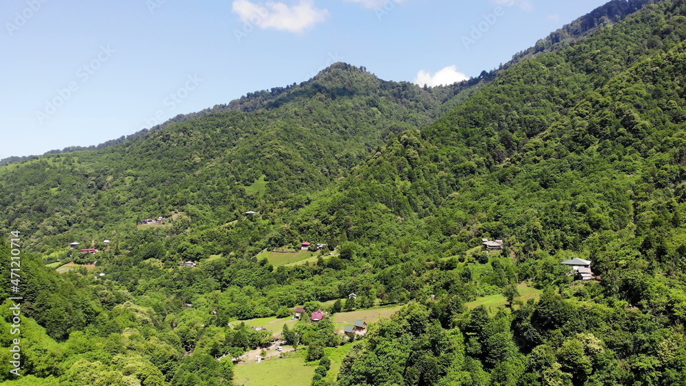 Fototapeta premium Flying over beautiful green mountains landscape, aerial shot, top view, wonderful world, scenic travel georgia