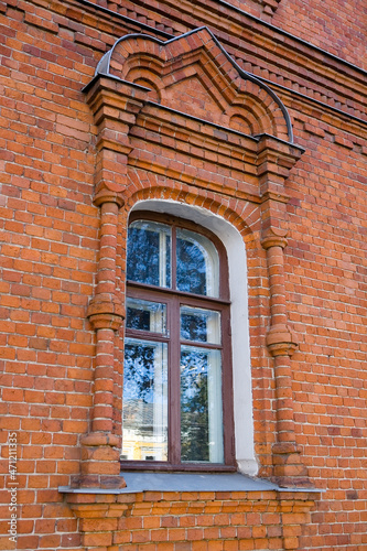A beautiful window of an old brick building.