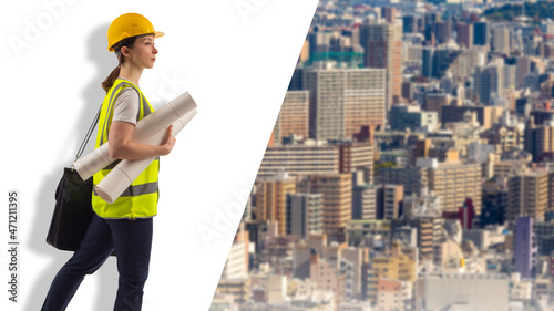 Woman builder with blueprints in hands. Bundle of papers in hand of builder. City buildings next to her. Young girl architect. Concept for career in construction industry. Selective focus