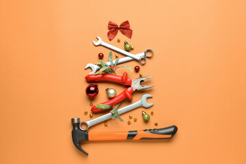 Christmas tree made of construction tools on color background