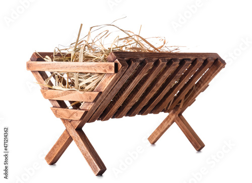 Foto Wooden manger with hay on white background