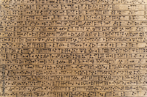 Babylonian historical writing background. Ancient hieroglyphs of the Sumerian and Babylonian civilizations. Archaeological objects and antiquities photo
