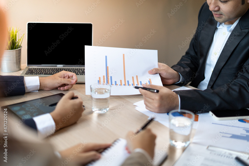analyst or financial advisor provides advice on securities analysis and stock market management. Businessman showing documents through graphs and charts. Brainstorm and work together