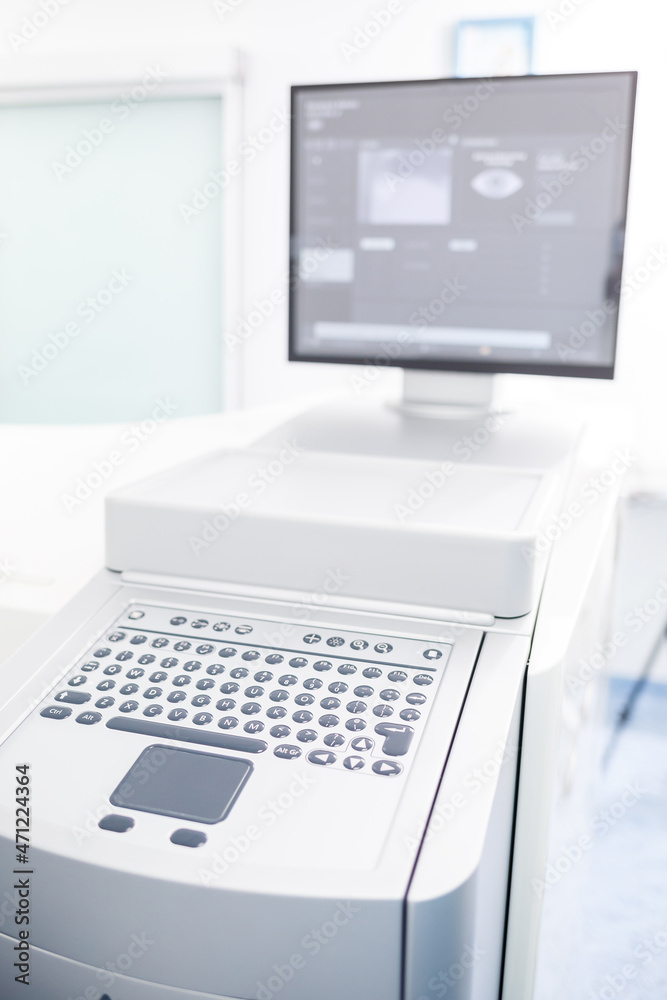 Microscopic apparatus for testing eyesight. Ophthalmology and treatment of eye diseases. Eye clinic, optometrist concept Microscopic apparatus for testing eyesight. Ophthalmology and treatment of eye diseases. Eye clinic, optometrist concept