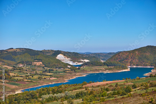 View of countryside lake Rovni, Serbia and hilly landscape in autumn colors.