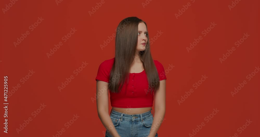 Lack of money. Dissatisfied sad young girl count cash feel stress on orange studio background. Poverty concept. Lack of money. Dissatisfied sad young girl count cash feel stress on orange studio background. Poverty concept.