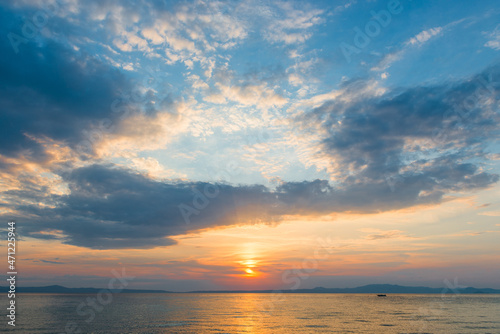 Fototapeta Naklejka Na Ścianę i Meble -  Evening sky with dramatic clouds over the sea. Dramatic sunset over the sea.