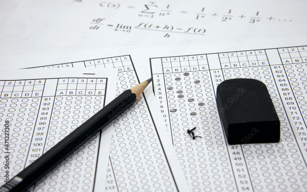 Multiple choice exam. Quiz. Concept of advanced exams for education with answer sheet, pencil. Multiple choice exam. Quiz. Concept of advanced exams for education with answer sheet, pencil.