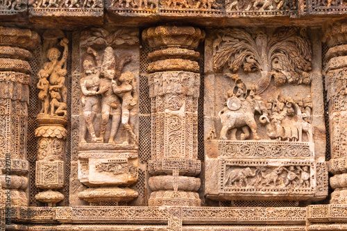 Temple platform of Jagamohana carved with erotic couples, young women flaunting their beauty in poses, nagas, vyalas, soldiers, elephants, court scenes Sun Temple Konark, Odisha, India.