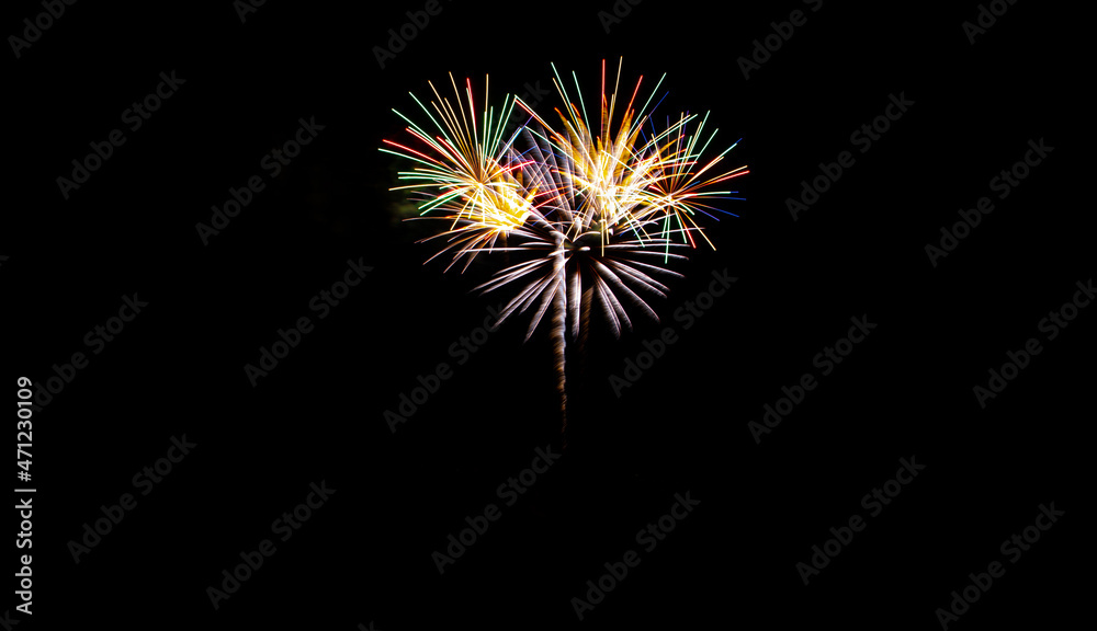 Festive fireworks on black background. Colorful celebration. Copy space.