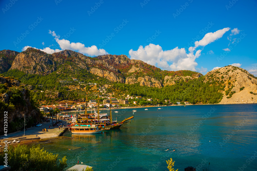 TURUNCH, TURKEY: Top view of the pirate ships and boats on the coast of Turunch on a sunny summer day.