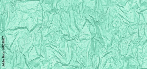 Mint green crumpled paper texture. Wrinkle pattern paper pastel color. Abstract wide background