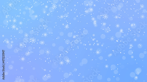 snow fall and bokeh on blue winter background