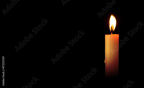 Burning candles on a black background. Blank space for inserting text. Ritual commemorations